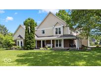 Charming two-story home boasting a large front porch and a well-manicured lawn under a beautiful blue sky at 244 W Admiral S Way, Carmel, IN 46032