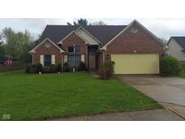 Charming single-Gathering home featuring a well-manicured lawn and inviting front yard at 3237 Boxwood Dr, Indianapolis, IN 46227