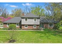 Charming brick and siding home featuring a well-maintained lawn and inviting curb appeal at 4337 Lincoln Rd, Indianapolis, IN 46228