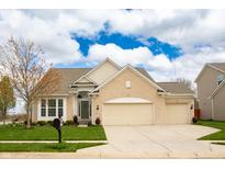 Charming ranch home featuring manicured lawn, two-car garage, and inviting front entrance at 6717 Marble Arch Way, Indianapolis, IN 46259