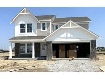 Charming two-story home with a brick-and-siding exterior and an attached two-car garage at 792 Oakleaf Dr, Greenfield, IN 46140