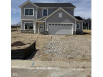 Newly built two story home featuring a two car garage and stone accents near the entryway at 2764 Glade Ave, Plainfield, IN 46168
