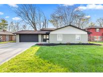 Charming ranch-style home featuring a freshly painted exterior and well-manicured lawn at 2815 Kay Ellen Dr, Indianapolis, IN 46229