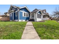 Charming blue two-story home with a well-maintained lawn and inviting walkway at 3967 N Park Ave, Indianapolis, IN 46205