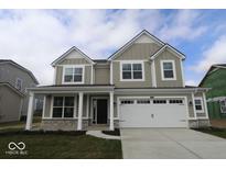 Two story home with stone accents, a two-car garage, and a covered entryway at 4152 Dutton Dr, Bargersville, IN 46106