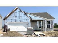 Charming one-story home featuring an attached garage and inviting covered porch in a vibrant community at 778 Oakleaf Dr, Greenfield, IN 46140