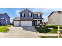 Charming two-story home featuring a well-manicured lawn, neutral siding, and a two-car garage, embodying modern suburban living at 8442 Averly Park Dr, Indianapolis, IN 46237