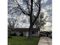 Charming single-story home with a well-maintained front lawn and inviting curb appeal at 212 Mooreland Dr, Whiteland, IN 46184