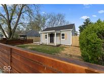 Charming single-story home with new gray siding, black roof, and a cozy front porch at 338 S Roena St, Indianapolis, IN 46241
