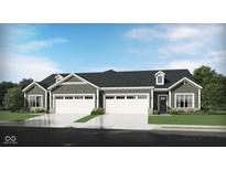 Charming duplex with two-car garages, dark roof, dormers, green siding, and well-manicured lawns at 2856 Piper Pl, Plainfield, IN 46168