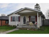 Charming home featuring a cozy front porch perfect for enjoying quiet mornings and relaxing evenings at 419 W Osage St, Greenfield, IN 46140