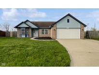 Charming single-Gathering home features a well-maintained lawn, attached garage, and inviting front entrance at 491 Westview Dr, Bargersville, IN 46106