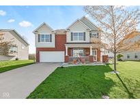 Charming two-story home with a well-manicured lawn and inviting curb appeal at 621 Sonoma Ln, Greenfield, IN 46140