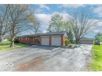 Charming single-story brick home with attached two car garage and a long driveway at 7825 N County Road 650 E, Brownsburg, IN 46112