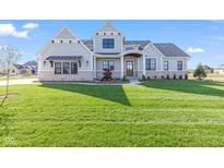 Beautiful two-story home with a well-manicured lawn, showcasing curb appeal at 8083 Easton Ln, Zionsville, IN 46077