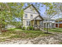 Charming two-story home with a well-maintained lawn and lovely curb appeal at 2225 Alabama St, Indianapolis, IN 46205
