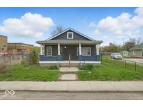 Charming single-story home featuring a cozy front porch and neatly trimmed landscaping at 2349 Indianapolis Ave, Indianapolis, IN 46208