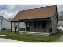 Charming bungalow-style home featuring a covered front porch, well-maintained lawn, and neutral siding at 518 N Grant St, Lebanon, IN 46052