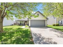 Charming single-Gathering home featuring a well-maintained lawn, a two-car garage, and inviting curb appeal at 11651 Beardsley Way, Fishers, IN 46038