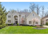 Stunning two-story home with light brick, mature landscaping, and inviting curb appeal in a desirable neighborhood at 14491 Jeremy Dr, Carmel, IN 46033