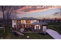Stunning two-story home featuring unique architectural design, professional landscaping, and a long driveway at 4292 Alderborough Way, Zionsville, IN 46077