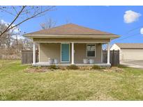 Charming single-story home with a quaint front porch and well-maintained lawn at 6194 Evanston Ave, Indianapolis, IN 46220