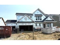 New construction home featuring a spacious design with a two-car garage in a residential neighborhood at 6217 Hampton Walk Blvd, McCordsville, IN 46055
