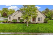 Charming, ranch-style home featuring manicured lawn and stone facade at 10794 Pine Needle Ct, Fishers, IN 46037