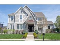 Beautiful two-story home with a professionally landscaped front yard and charming exterior at 12725 Parsons Gate, Carmel, IN 46032