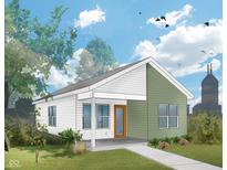 Charming single-story home with white and green siding, a sidewalk, and an inviting orange front door at 1643 Sheldon St, Indianapolis, IN 46218