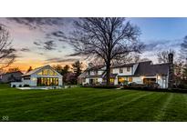 Backyard features a pool, poolhouse, and meticulous landscaping offering a serene outdoor experience at 1995 W 116Th St, Carmel, IN 46032