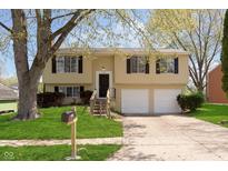 Charming two-story home with a well-maintained lawn and a two-car garage at 2601 Fairhaven Dr, Indianapolis, IN 46229