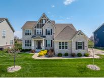 Stunning two-story home boasts manicured landscaping, gray brick facade, and a welcoming front entrance at 3997 Spylaw Rd, Bargersville, IN 46106