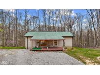 Charming single-story home with a covered front porch and a swing for relaxing at 4976 W Sims Ln, Monrovia, IN 46157