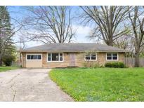 Charming single-story home featuring a stone facade and a well-maintained front yard at 225 Vali Ct, Carmel, IN 46280