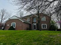 Traditional brick home with a well-manicured lawn and mature trees in a desirable location at 5773 Station Hill Dr, Avon, IN 46123