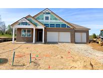 New construction home featuring a brick exterior and a two-car garage at 5924 Trichel Dr, Greenwood, IN 46143