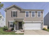 Charming two-story home featuring a well-maintained lawn and a two-car garage at 3189 Underwood Dr, Whiteland, IN 46184