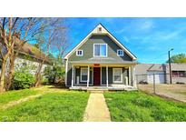 Charming front exterior with a peaked roof, quaint porch, and well-maintained lawn at 3532 E 10Th St, Indianapolis, IN 46201