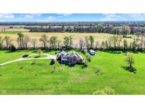 Stunning aerial view of a grand home surrounded by lush greenery and scenic countryside at 5299 W Pr Black Hawk, Edinburgh, IN 46124