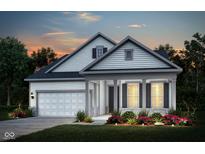 Charming home with a covered porch, two-car garage, and a beautifully landscaped yard at 5661 Stetson Dr, Whitestown, IN 46052