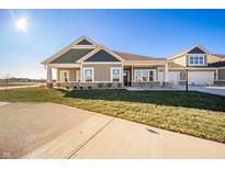 Charming single-story home with a well-manicured lawn, covered entry, and attached two car garage at 6204 Fairview Dr, McCordsville, IN 46055