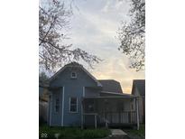 Charming exterior of a cozy home featuring a covered front porch at 644 Warren Ave, Indianapolis, IN 46221