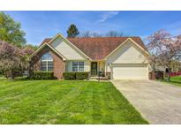 Charming single-Gathering home features a well-manicured lawn and a classic brick and vinyl facade at 7114 Hickory Rd, Indianapolis, IN 46259