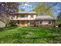 Charming two-story home with a well-manicured lawn and inviting curb appeal at 12867 Andover Dr, Carmel, IN 46033