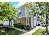 Charming townhouse featuring brick accents, manicured landscaping, and inviting curb appeal at 2270 Brightwell Pl, Indianapolis, IN 46260