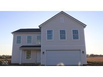 Charming new two-story home showcasing a symmetrical design with multiple windows and a two-car garage at 3832 Highcrest Rd, Indianapolis, IN 46239
