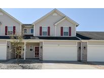 Inviting home featuring red shutters, a two-car garage, and manicured landscaping at 1175 Bent Tree Way, Plainfield, IN 46168