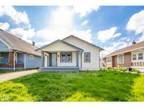 Charming home featuring a cozy front porch and well-manicured lawn at 2034 Mansfield St, Indianapolis, IN 46202