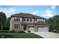 Charming two-story home boasts a brick and siding exterior with a two-car garage and a well-manicured lawn at 4302 Persian St, Greenwood, IN 46143